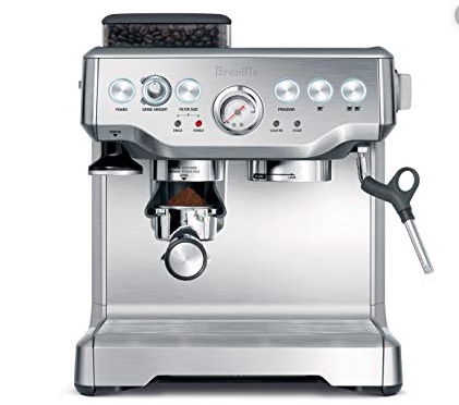 A stainless steel espresso machine with a built-in grinder, perfect for your newly renovated kitchen in Madison, WI. It features a central pressure gauge, various buttons and dials, front panel indicators, a portafilter for dispensing coffee grounds underneath the grinder, and a steam wand on the right.