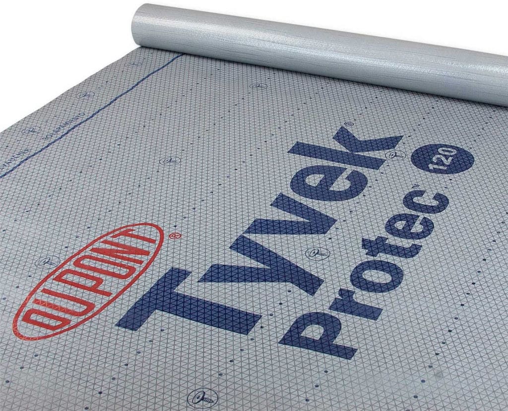 A roll of gray Dupont Tyvek Protec 120 roofing underlayment, perfect for exterior renovations in Madison, WI, is partially unrolled. The material features a printed grid pattern and the Dupont logo, along with the text "Tyvek Protec 120" in blue.